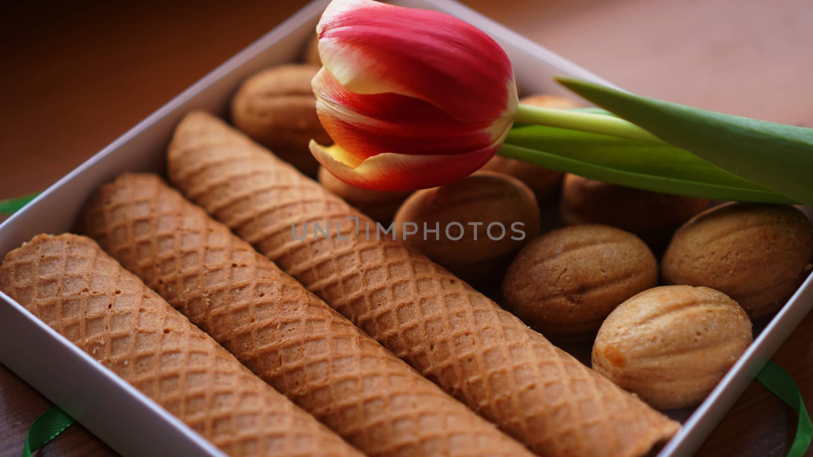 Shortbread cookies and tulips. Gift to the woman. Russian Sweets - oreshki cookies and tubes