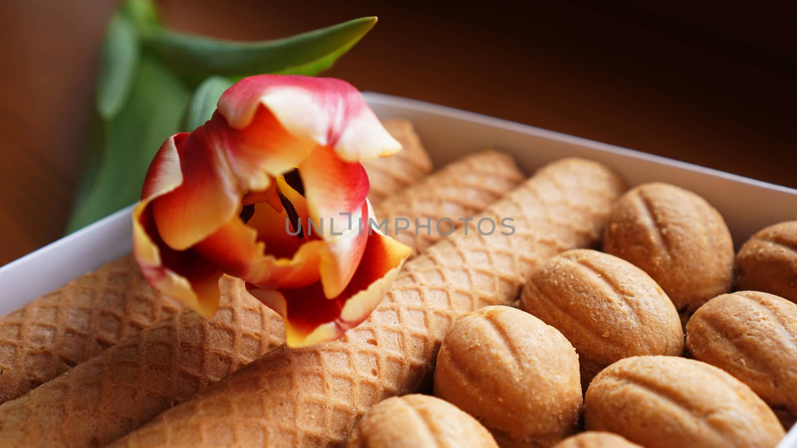 Shortbread cookies and tulips. Gift to the woman. Russian Sweets - oreshki cookies and tubes