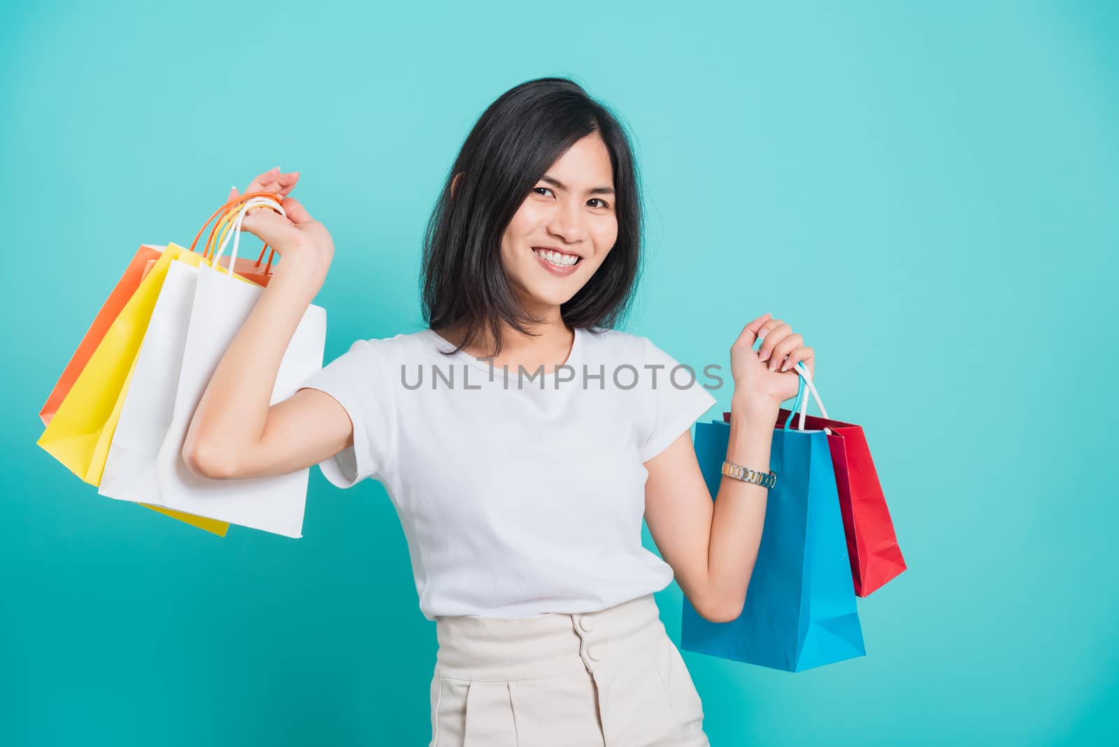 woman standing wear white t-shirt, holding shopping bags multi c by Sorapop