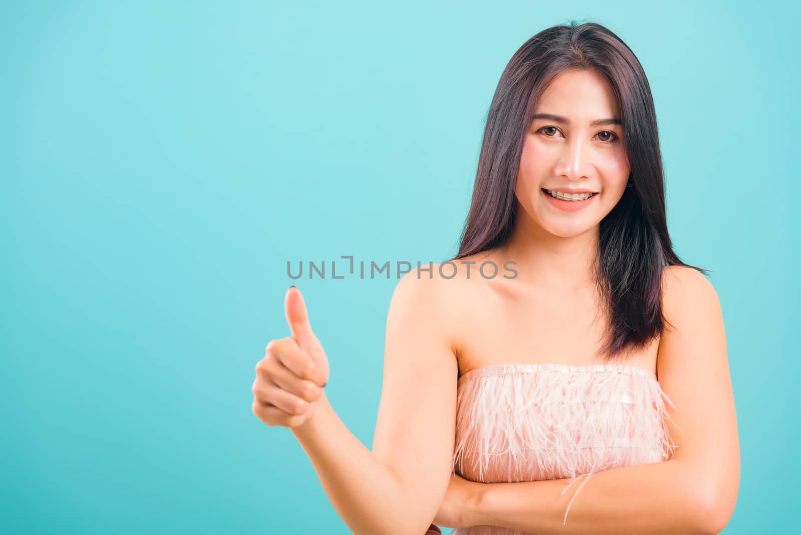 Portrait asian beautiful woman smiling her showing thumbs up and by Sorapop