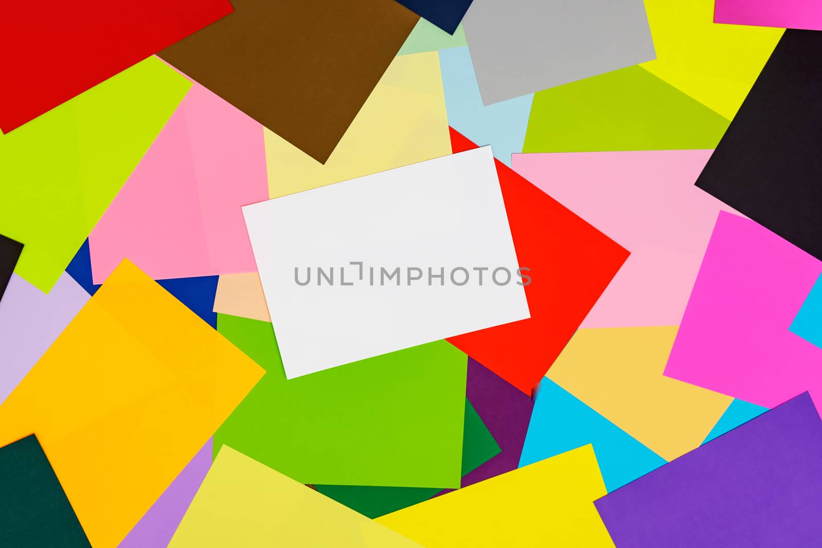A multi-colored kaleidoscope of colored sheets of paper scattered chaotically in a controlled, beautiful chaos style for a colorful background.