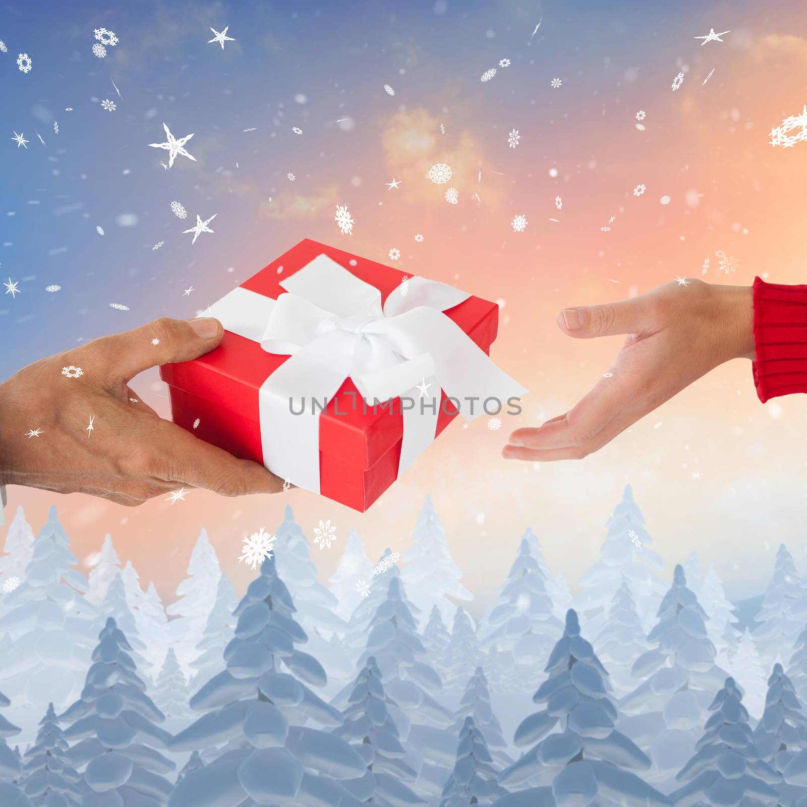 Composite image of couple holding gift by Wavebreakmedia