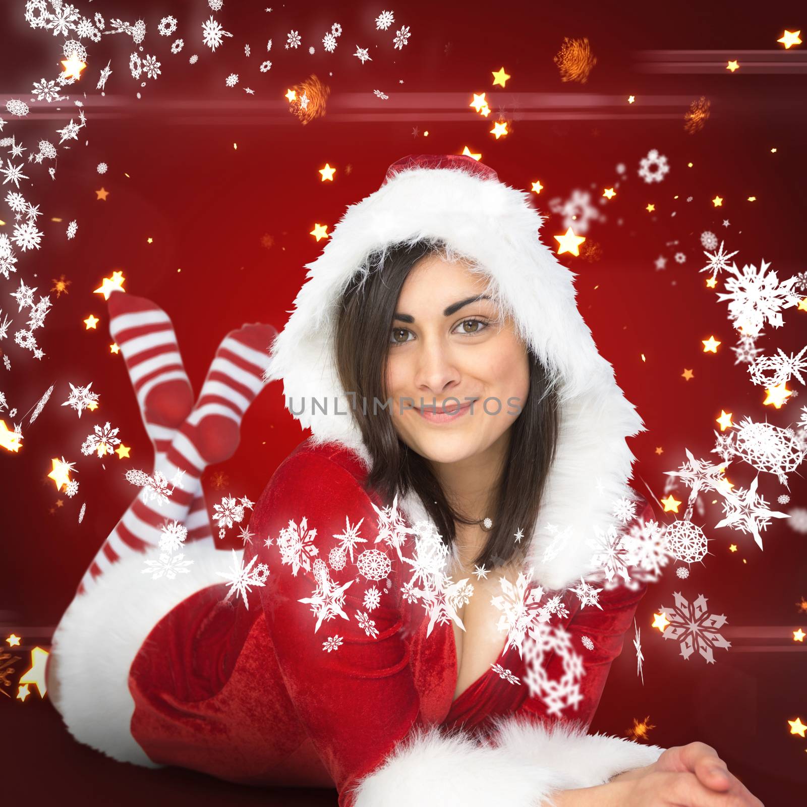 Pretty girl smiling in santa outfit against bright star pattern on red