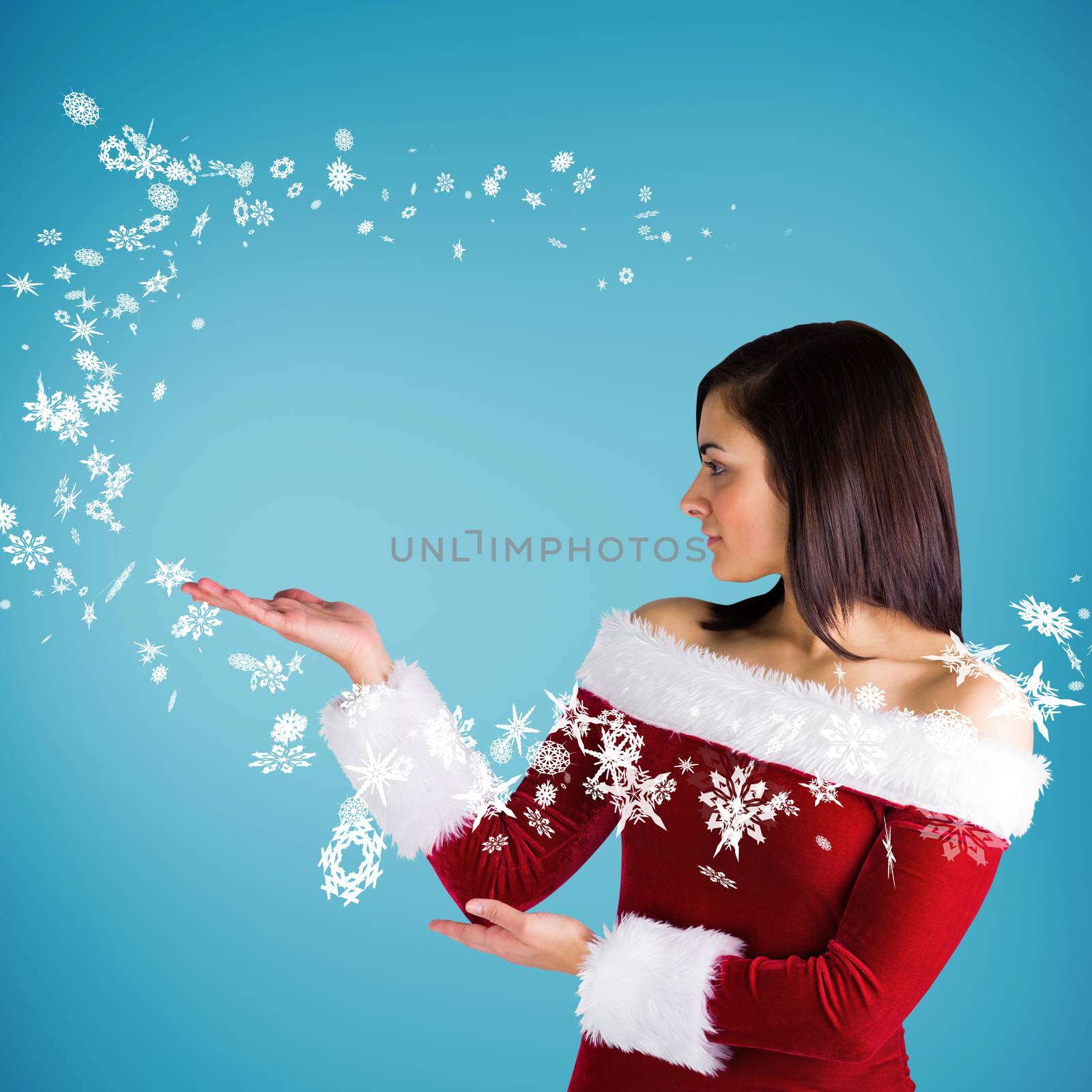 Pretty girl presenting in santa outfit against blue vignette