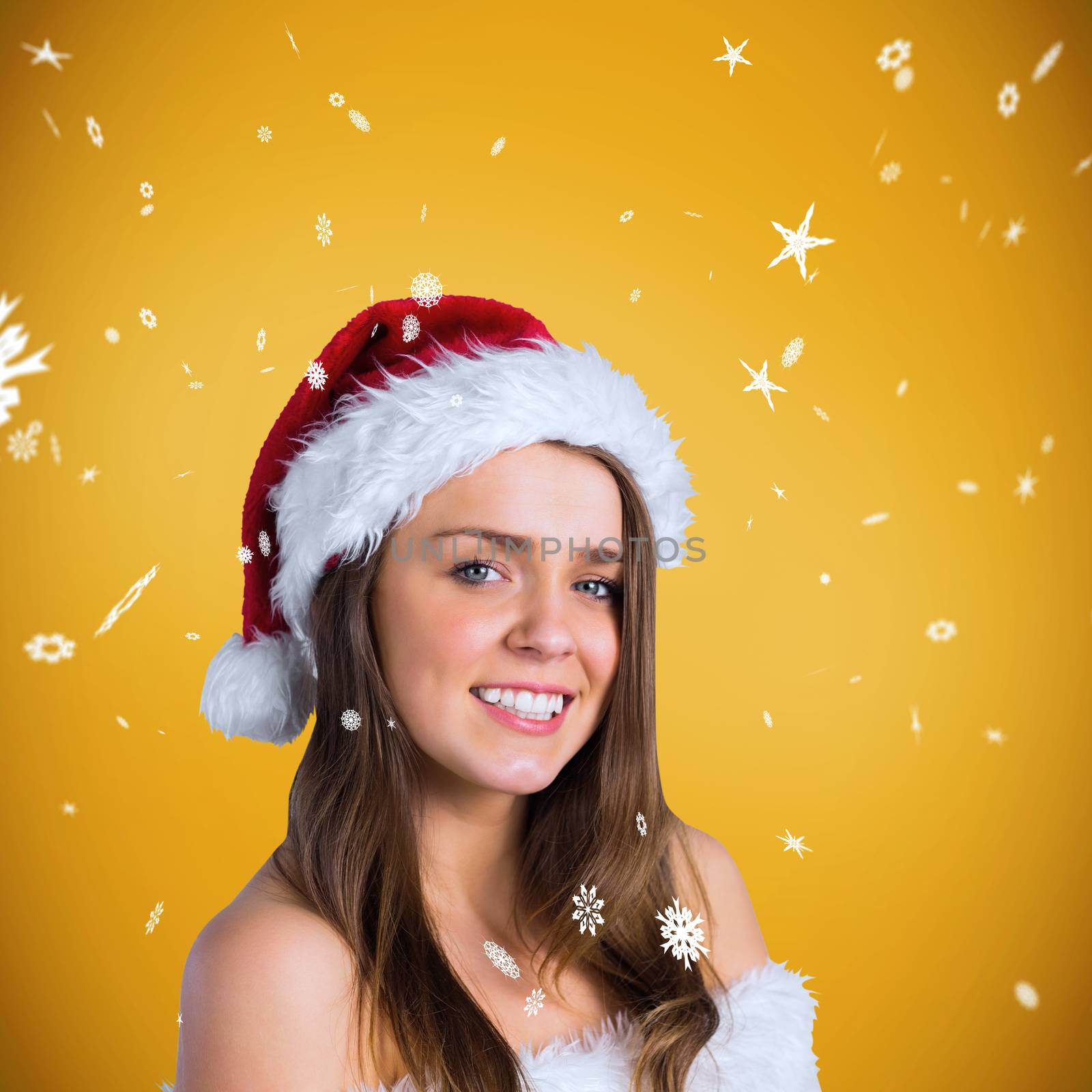 Sexy santa girl smiling at camera against yellow background with vignette