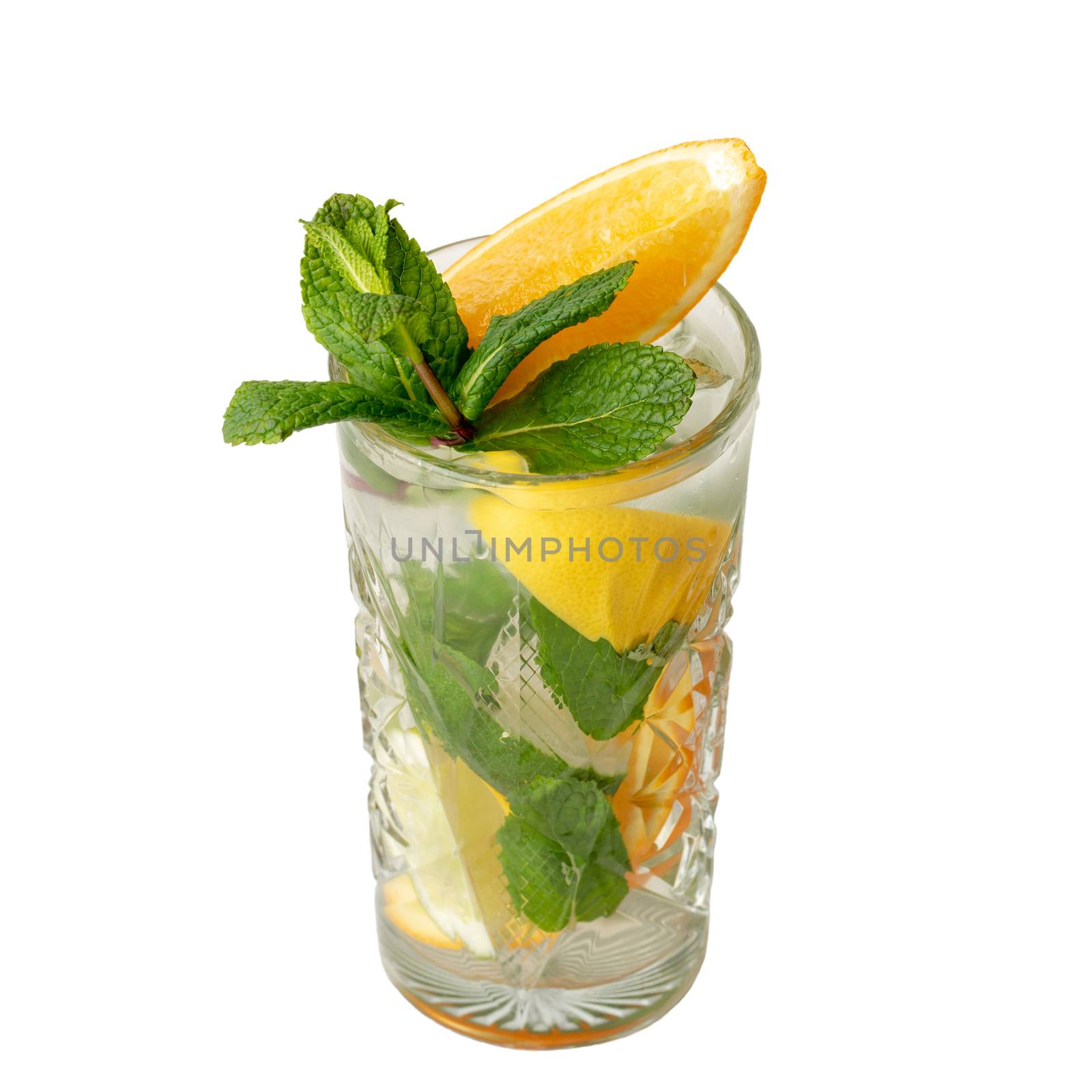 Cold alcohol cocktail drink with slices of lemon and lime, mint leaf isolation on a white
