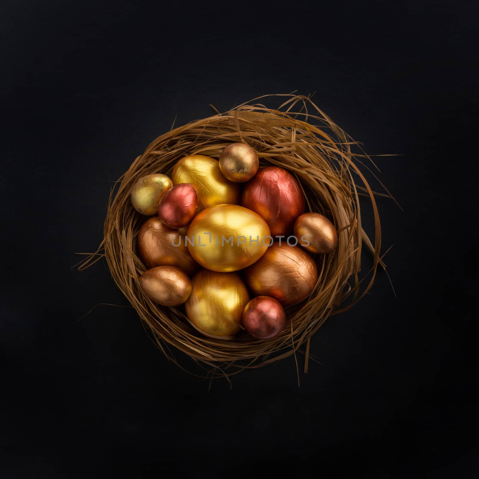 Easter nest with golden eggs by destillat