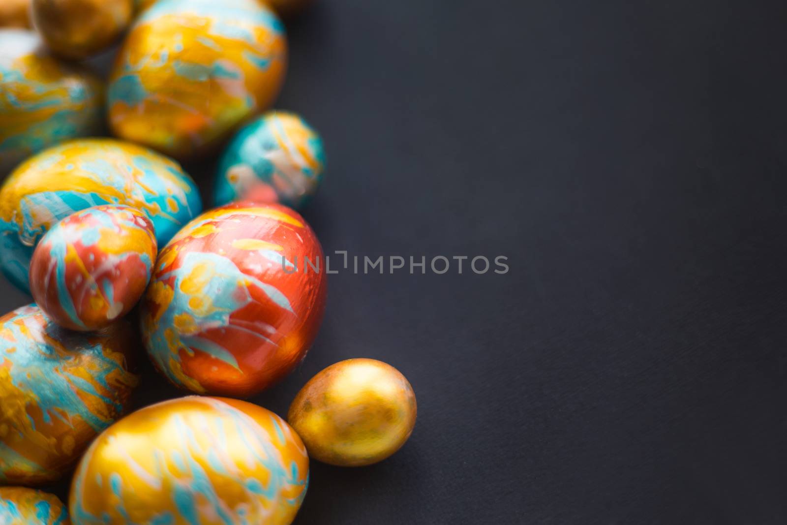 Handmade easter eggs on black by destillat