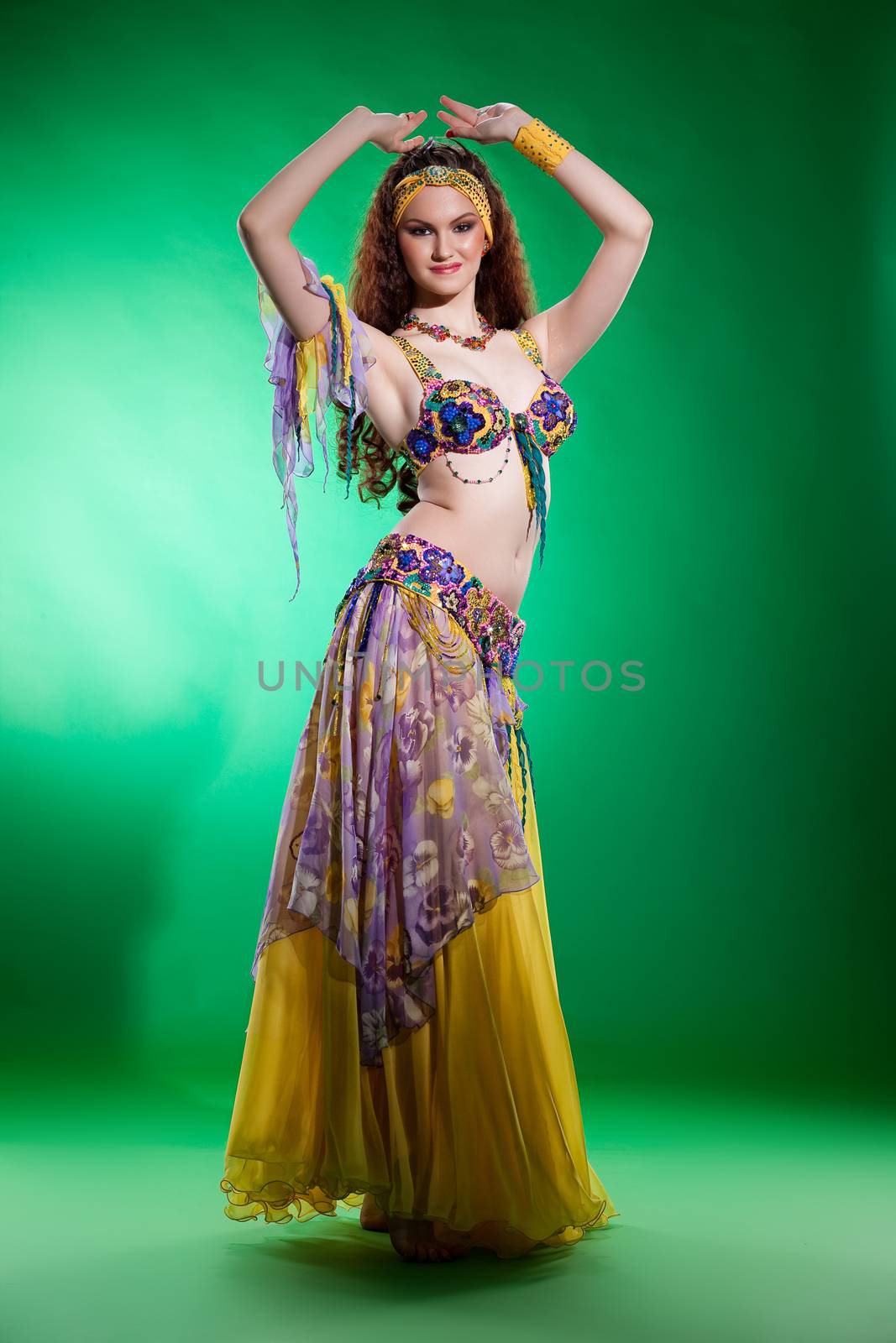 Young woman dressed in a traditional eastern dancing clothing