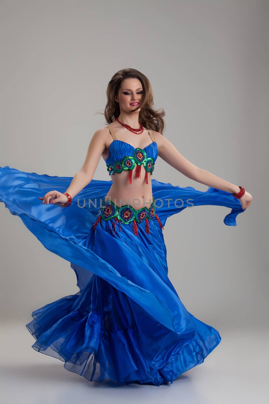 Young woman in traditional eastern dancing clothing