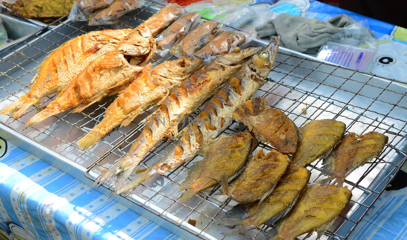 Deep fried Tilapia Fish in the market of street food concept.