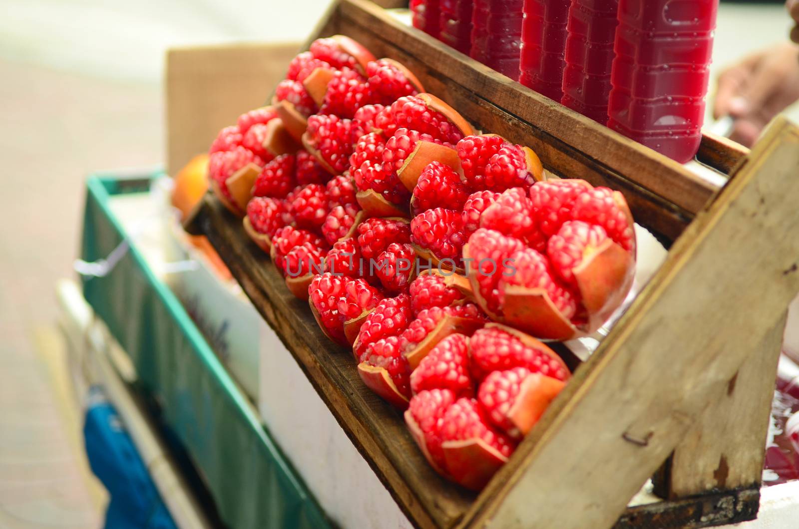 Pomegranate fruit. Pomegranates Juice sold in the chinatown market . 