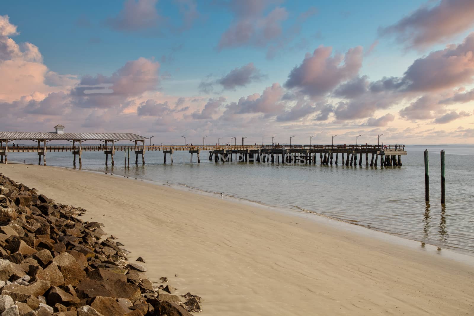 Pier and Empty Beach Beyond Seawall by dbvirago