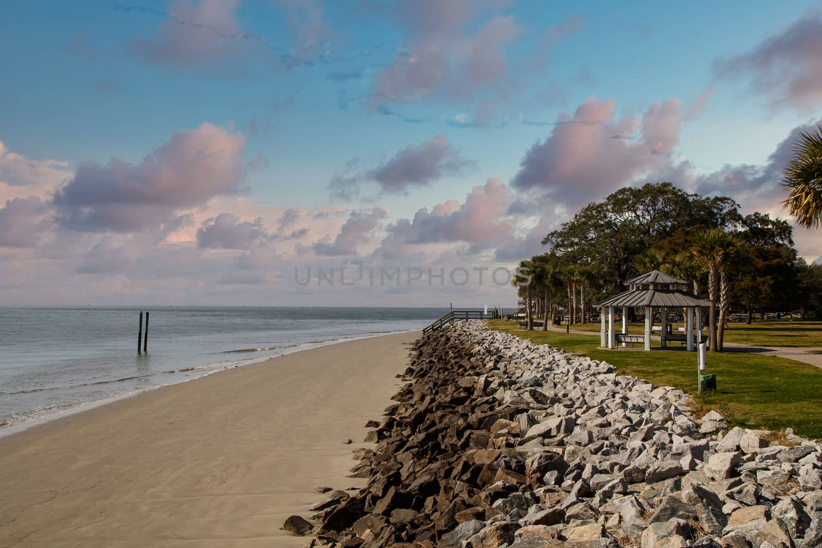 A stone seawall along a winter beach