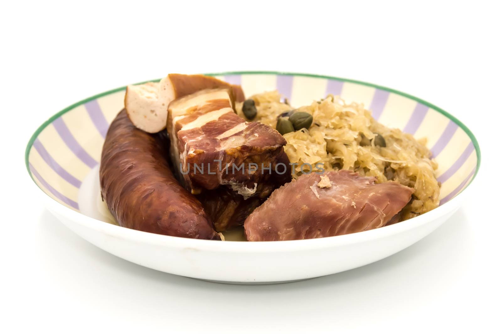 Central and Eastern European cuisine sauerkraut - riesling sauerkraut with bacon and sausage on a white background