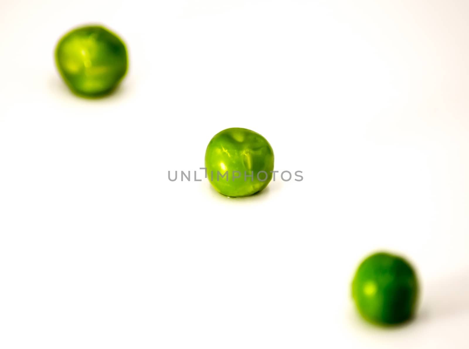 Green peas on a white background