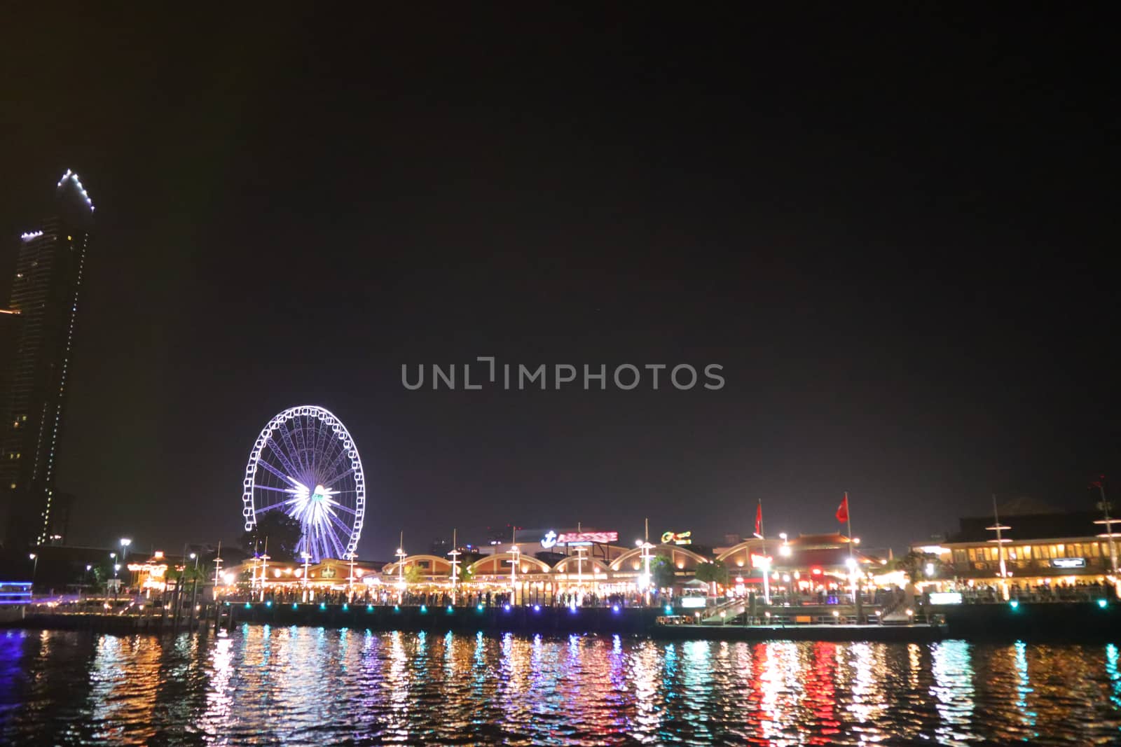 embankment at Chao Phraya River in Bangkok city. cityscape in the evening. Nigt life in asia