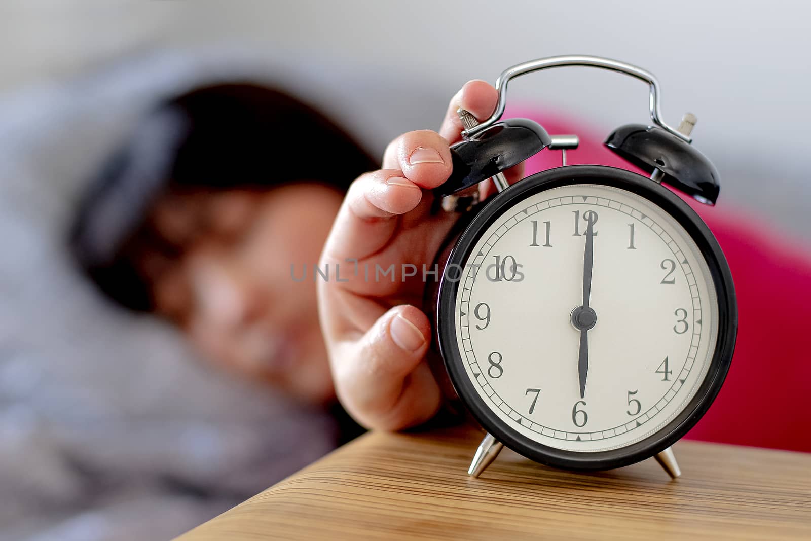 Daylight Saving Time woman waking up by oasisamuel
