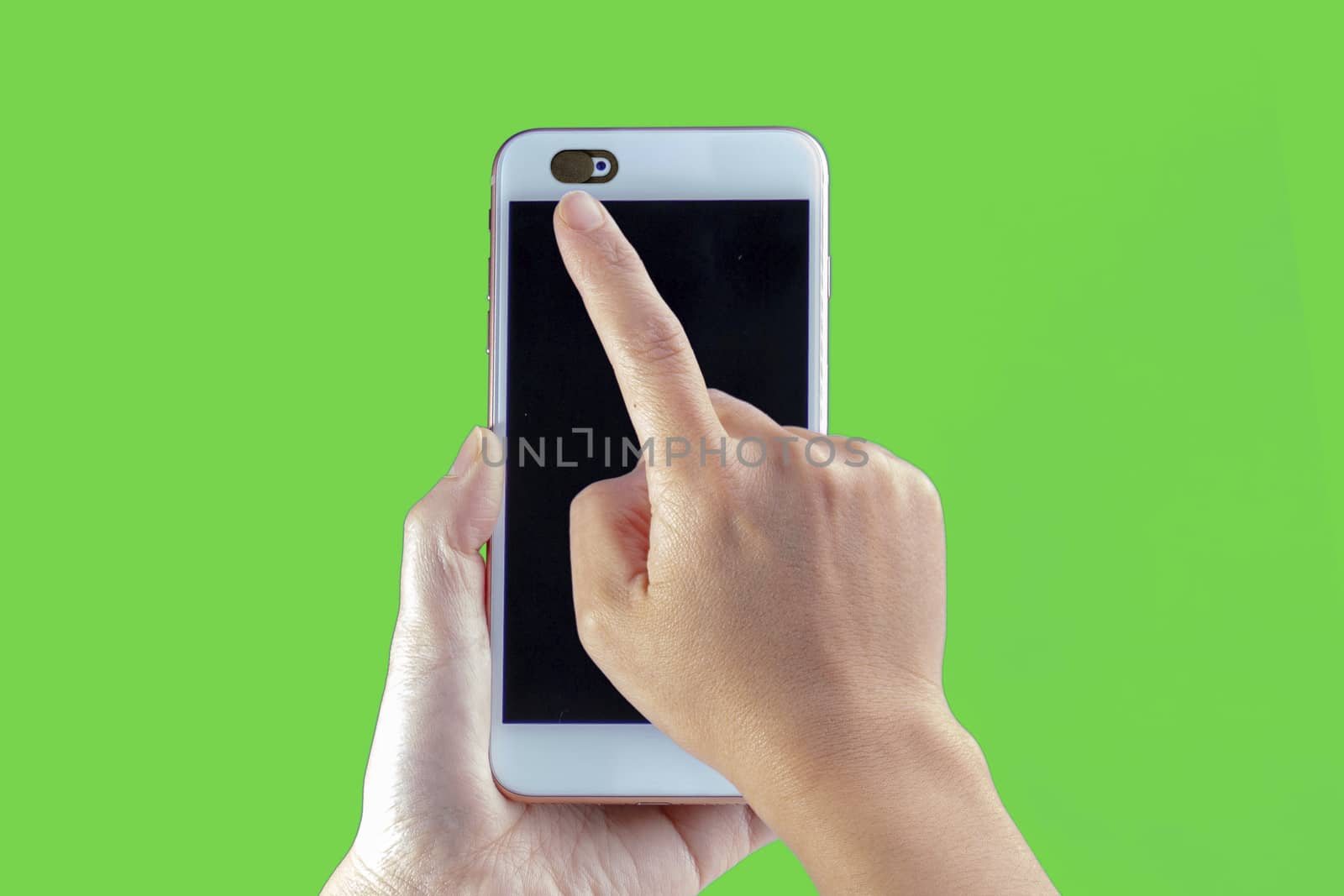 Camera privacy cover slide, for front camera cover for smart device hand hold on a green background by oasisamuel