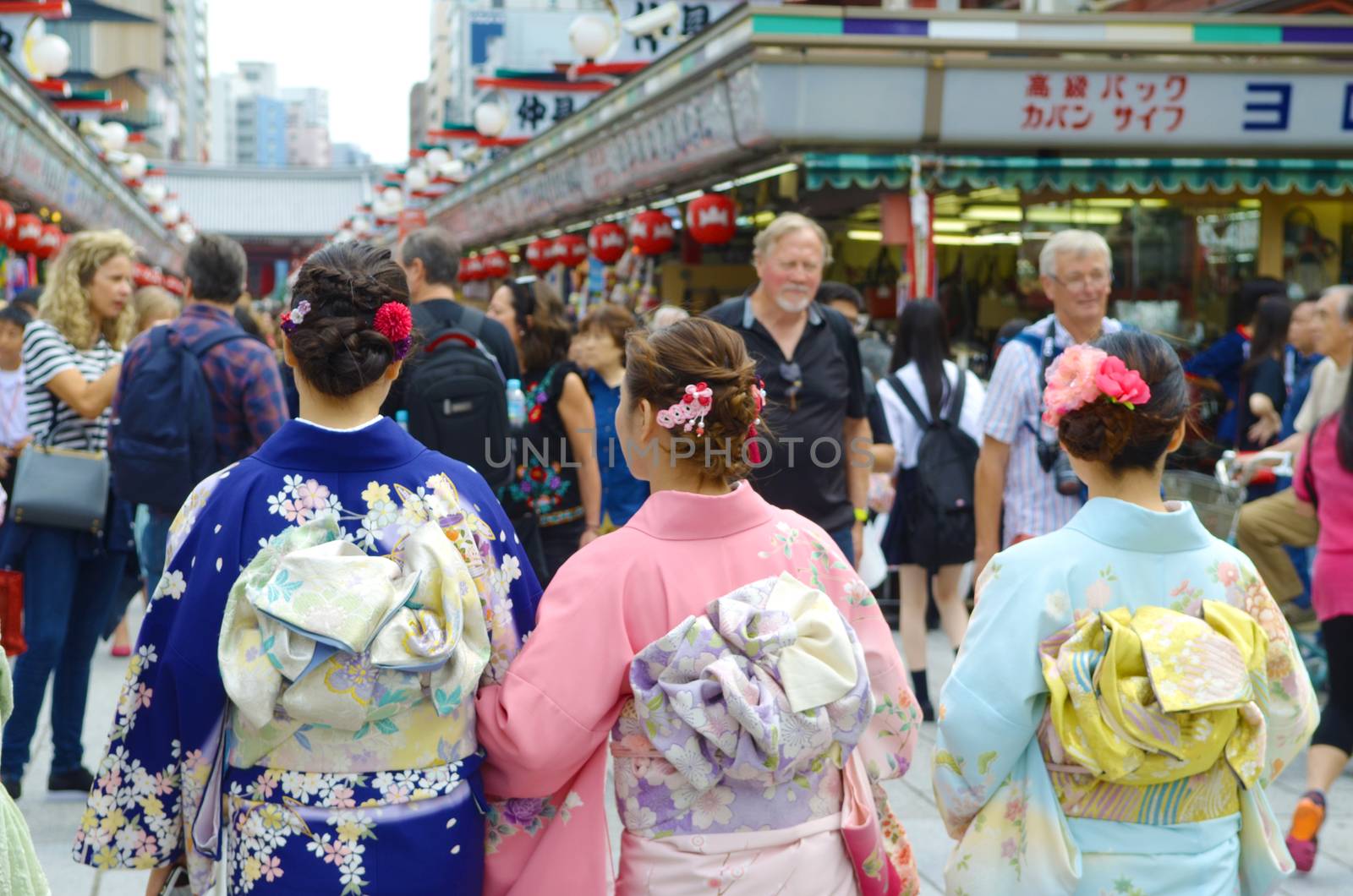 TOKYO JAPAN , MAY 28 2018.Young girl wearing Japanese kimono walking at street in front of  Sensoji Temple in Tokyo, Japan. Kimono is a Japanese traditional garment. 