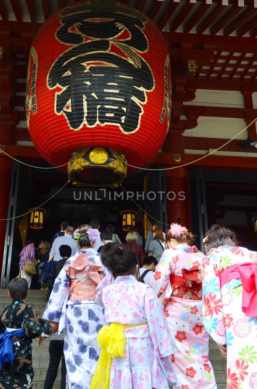 .Japanese family wearing Japanese kimono Tourists come to pay homage to buddha at  Sensoji temple Asakusa, Tokyo.