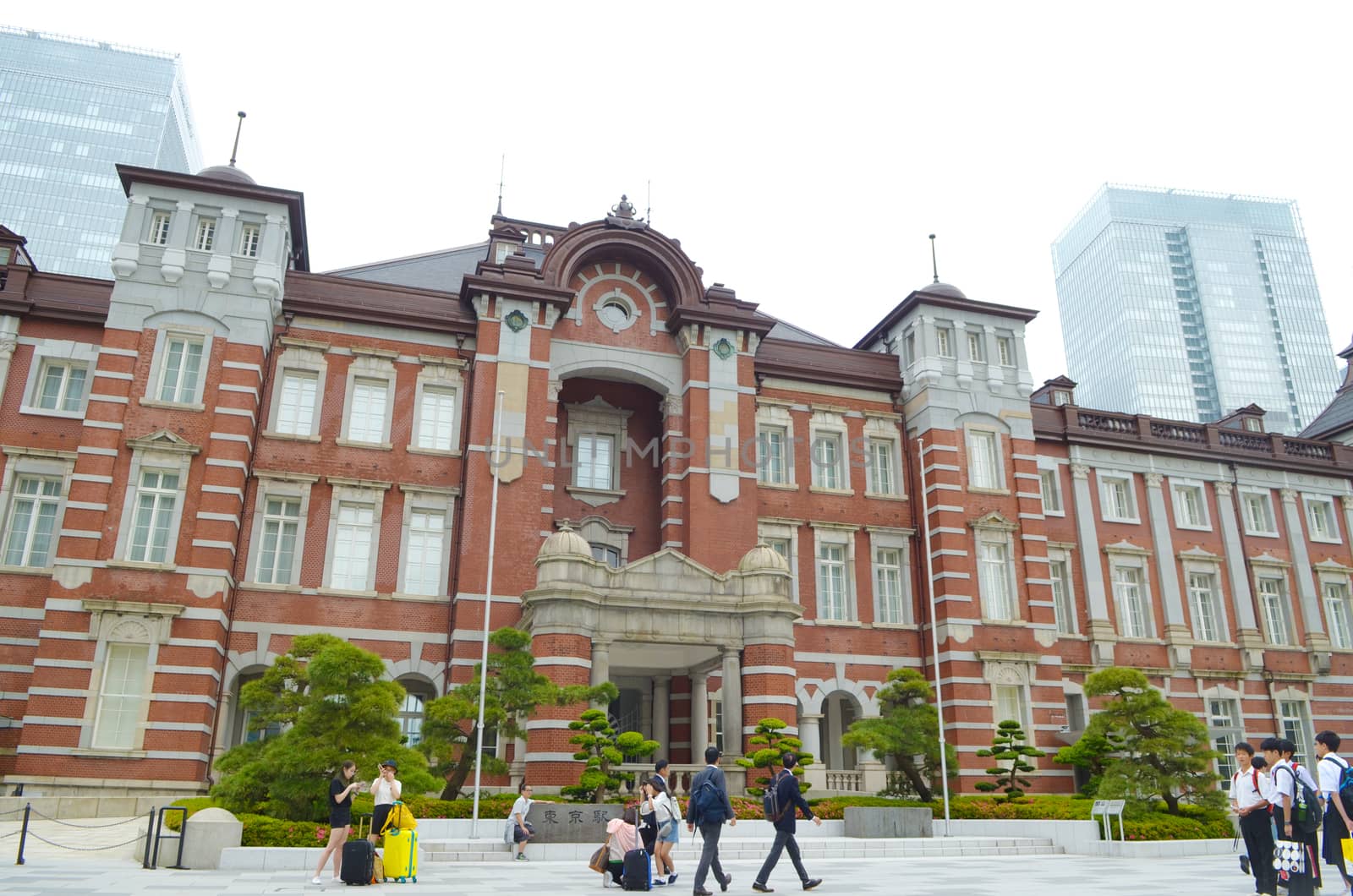 TOKYO, JAPAN - MAY 30, 2018 : People passing the Marunouchi Station Building at Tokyo Station, Tokyo Station is the main intercity rail terminal in Tokyo and busiest station in Japan.