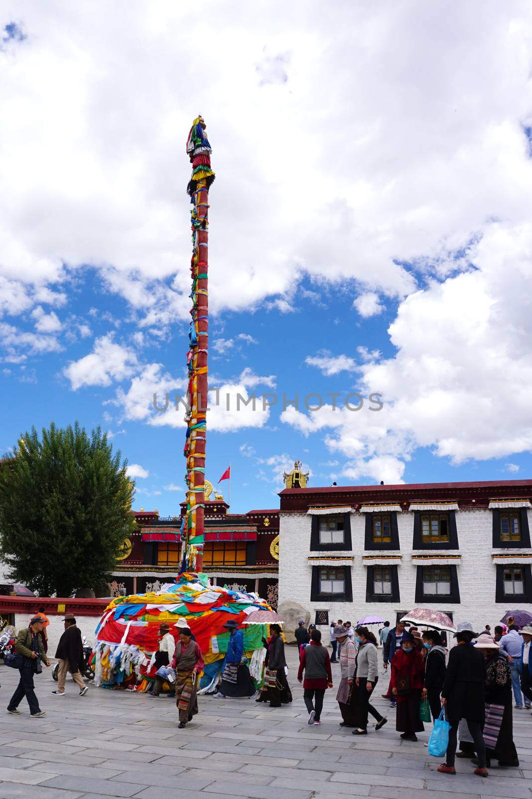 Tibet, China - May 31, 2017. People on main square in Lhasa, Tibet, China. Tibet is a historical region covering much of the Tibetan Plateau in Central Asia.