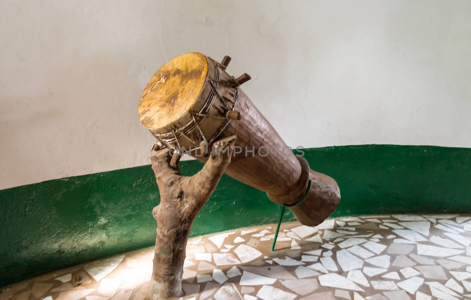 Original African djembe drum with leather blade lay on a treadmill forming a trunk in Gambia