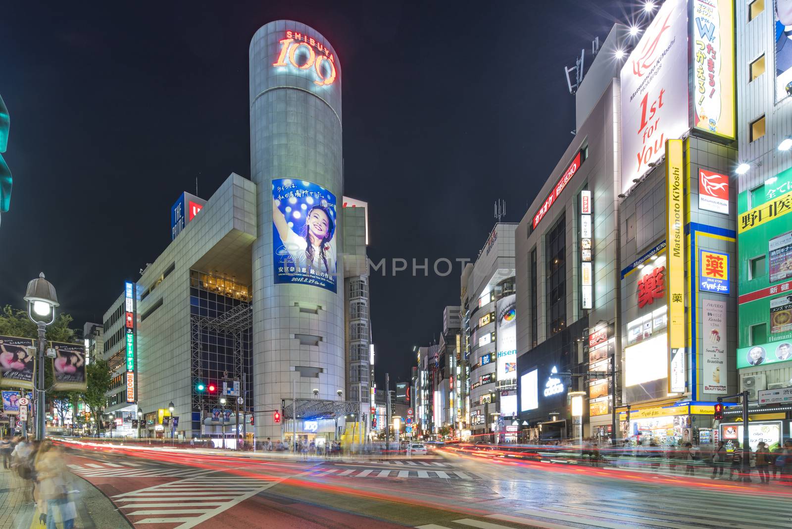 TOKYO, JAPAN - August 21 2018: Futuristic architecture with mirroring panels swiveling in Shibuya district in Dogenzaka street leading to Shibuya Crossing Intersection in front of Shibuya Station in a summer evening.