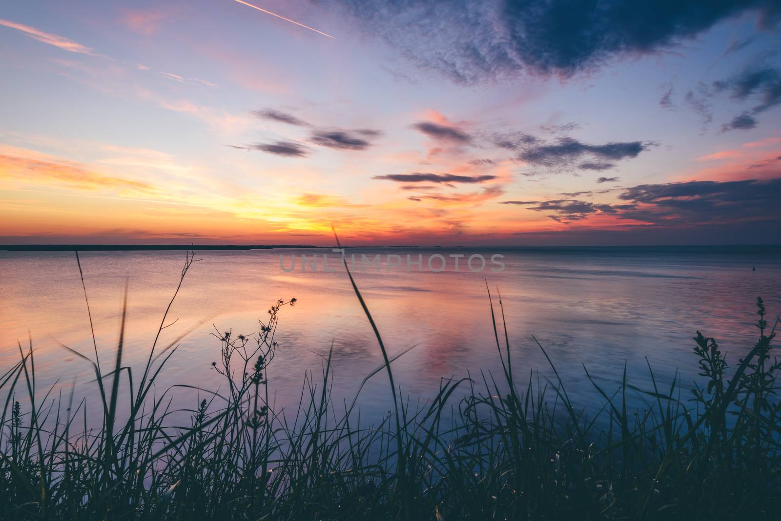 Sunrise on Volga river with reflected sky