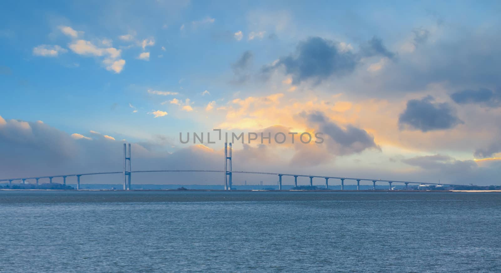 Suspension Bridge Through Blue Haze at Sunset by dbvirago