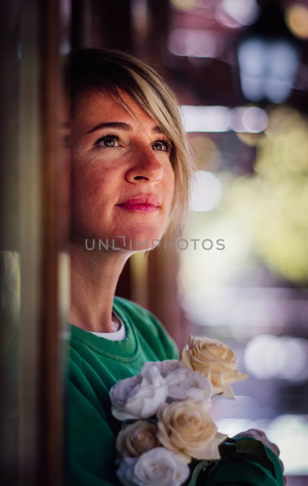 Portrait of a pretty blonde woman with bouquet. by Emurado