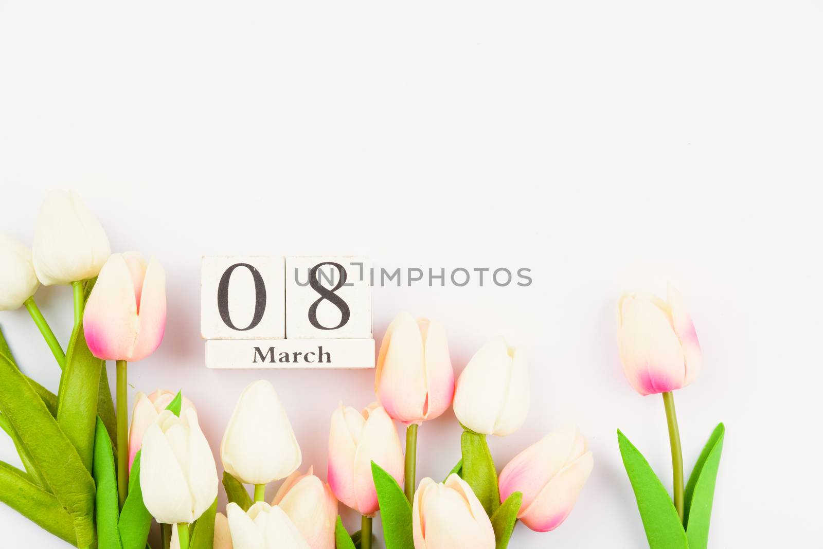 Happy Women's Day, Mother's Day and Valentine's Day concept. top view flat lay Tulip flower on white background, copy space for your text