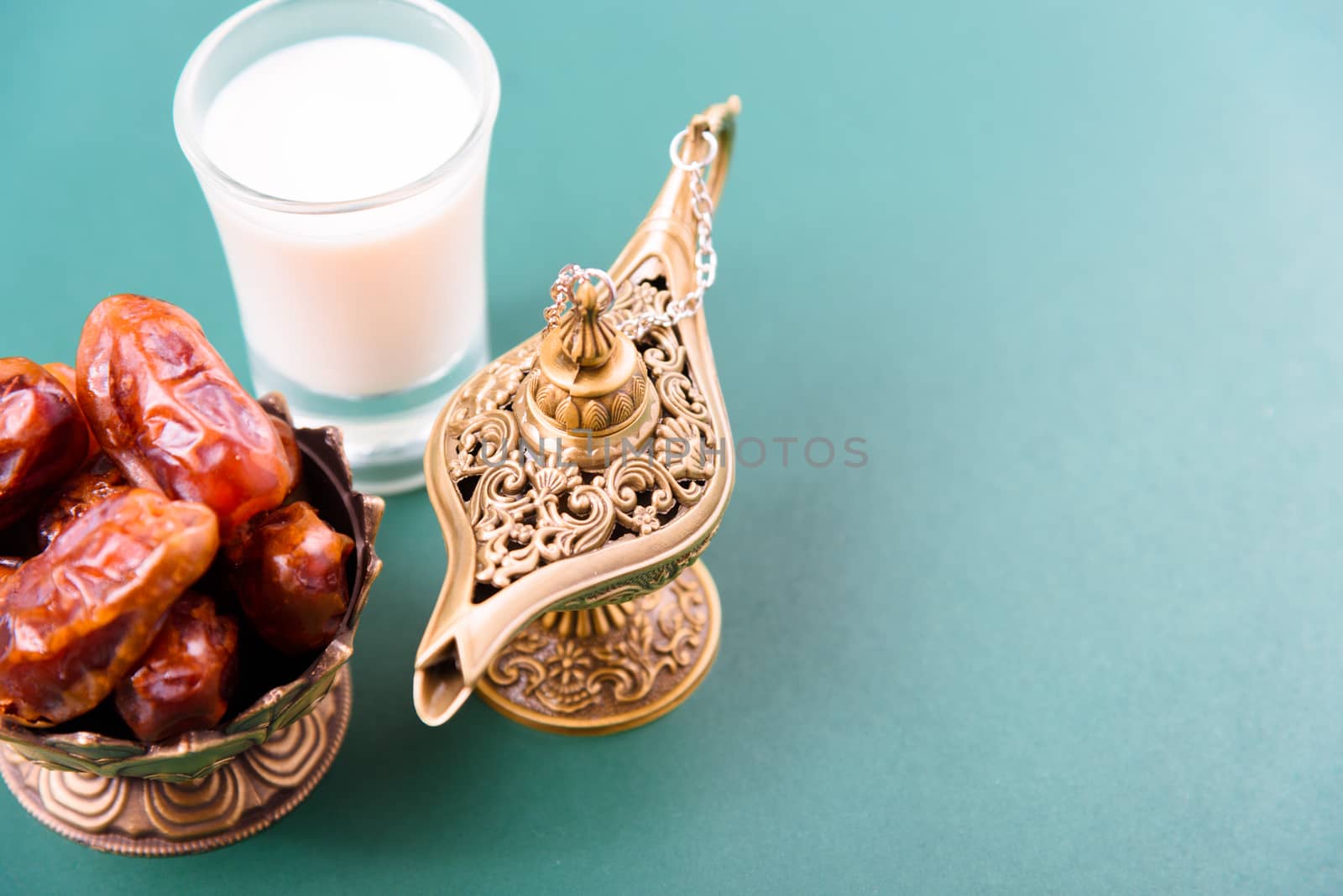Ramadan, Dates in golden bowl, Milk, arabian Aladdin golden lamp vintage style on black green background