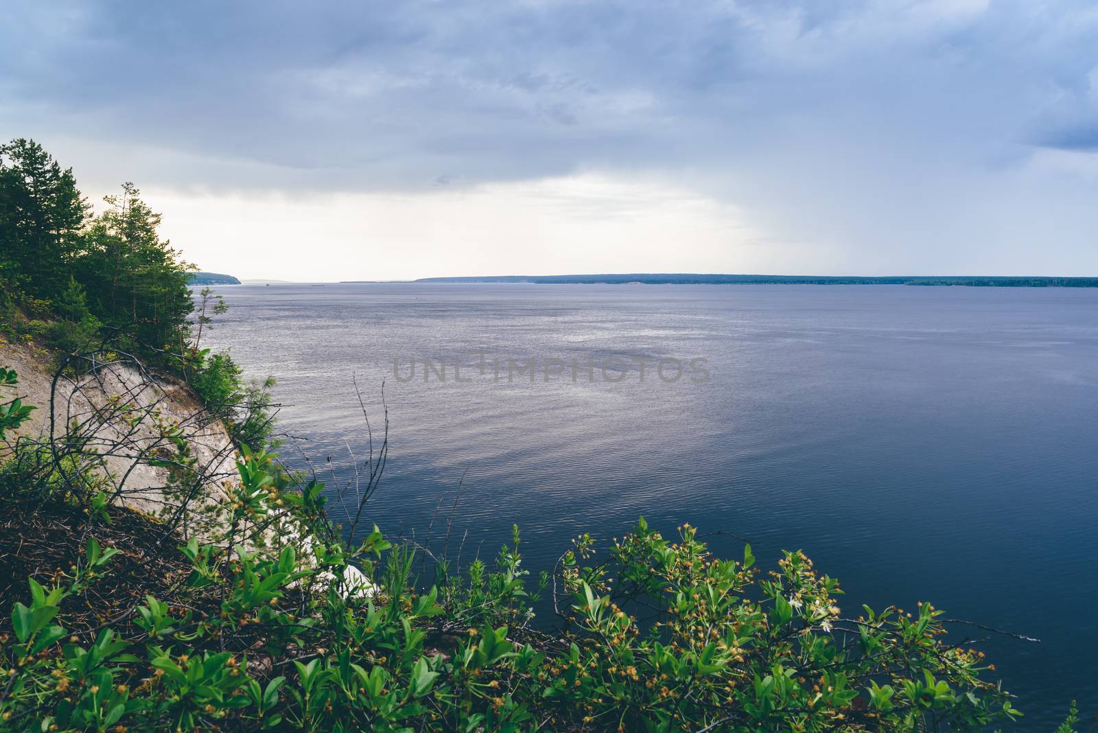 Overcast sky over the river. Vew from cliff.