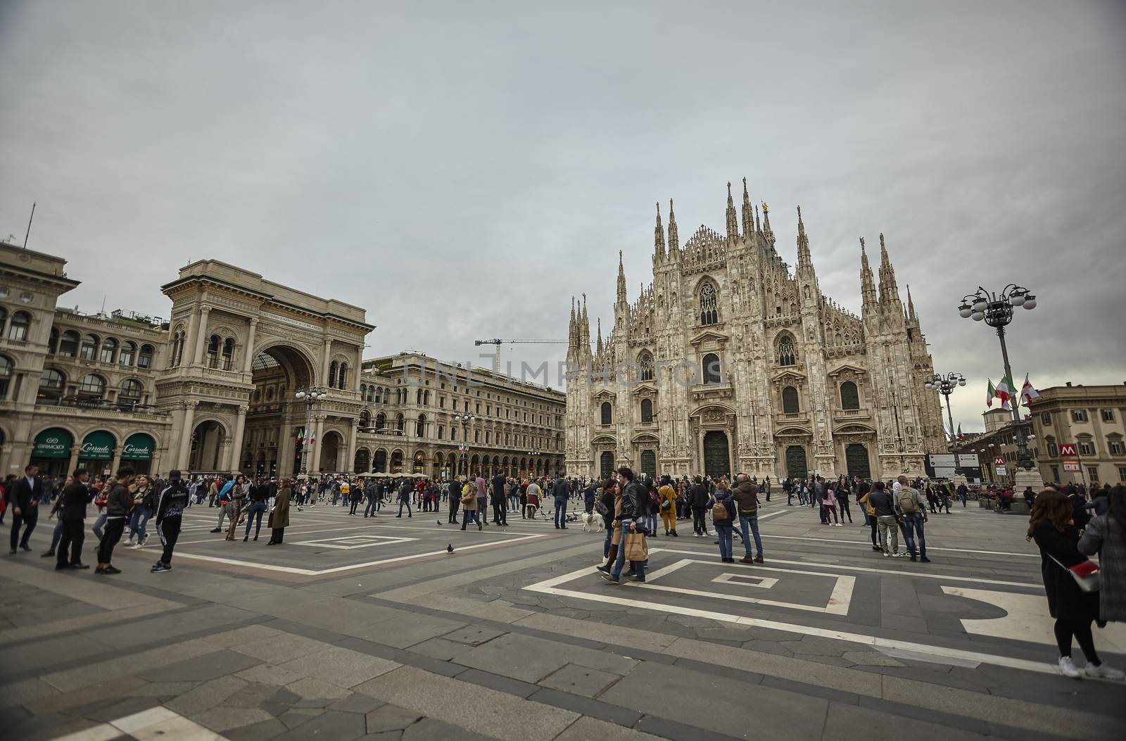 MILAN, ITALY 10 MARCH 2020: Milan Cathedral with tourists and people strolling en masse on the square