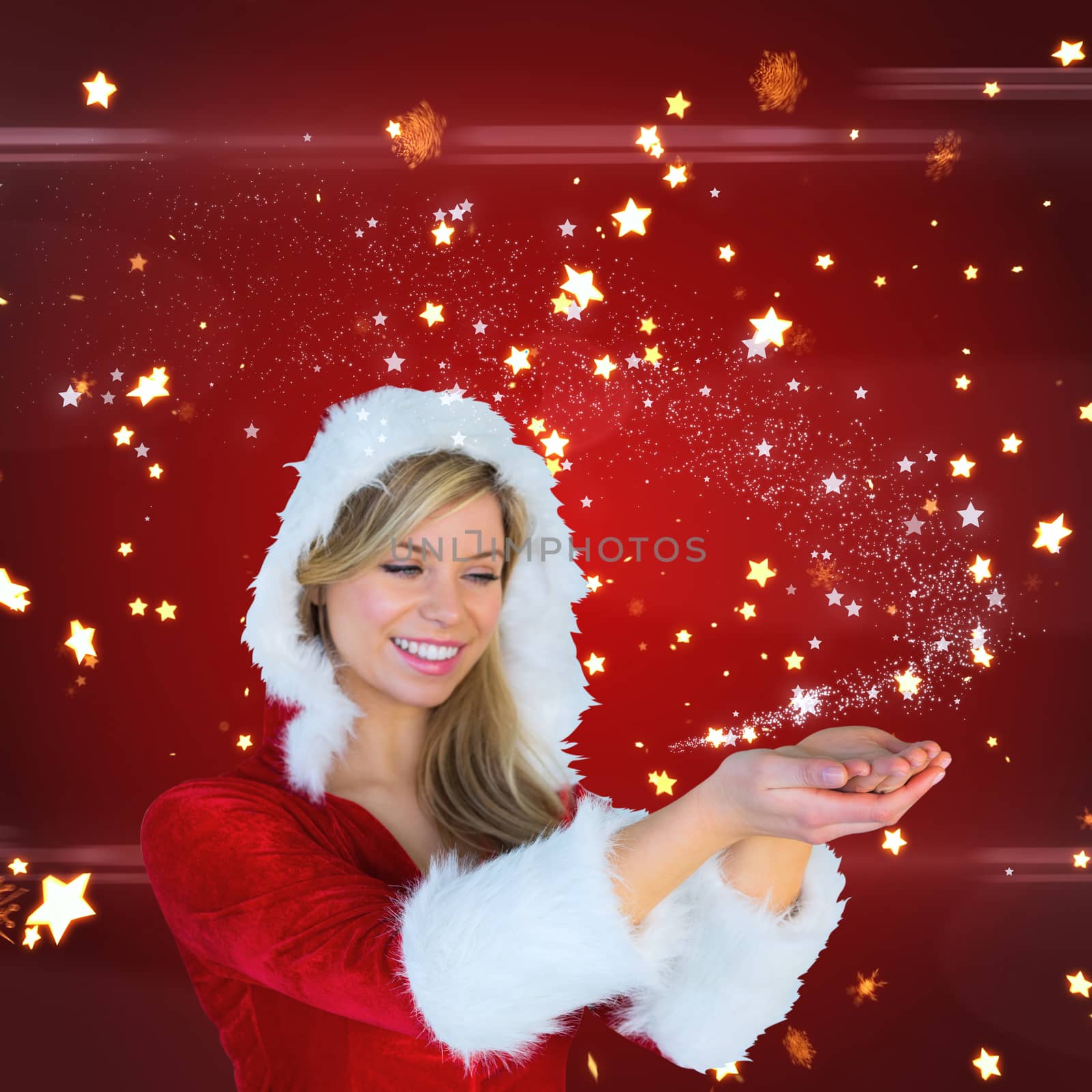 Composite image of pretty girl holding hands out in santa outfit by Wavebreakmedia