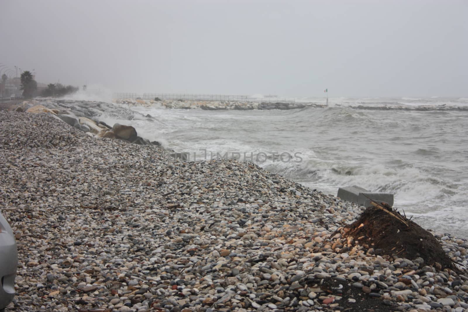 gray storm on small rocks of Liguria in a gloomy tragic day in Italy