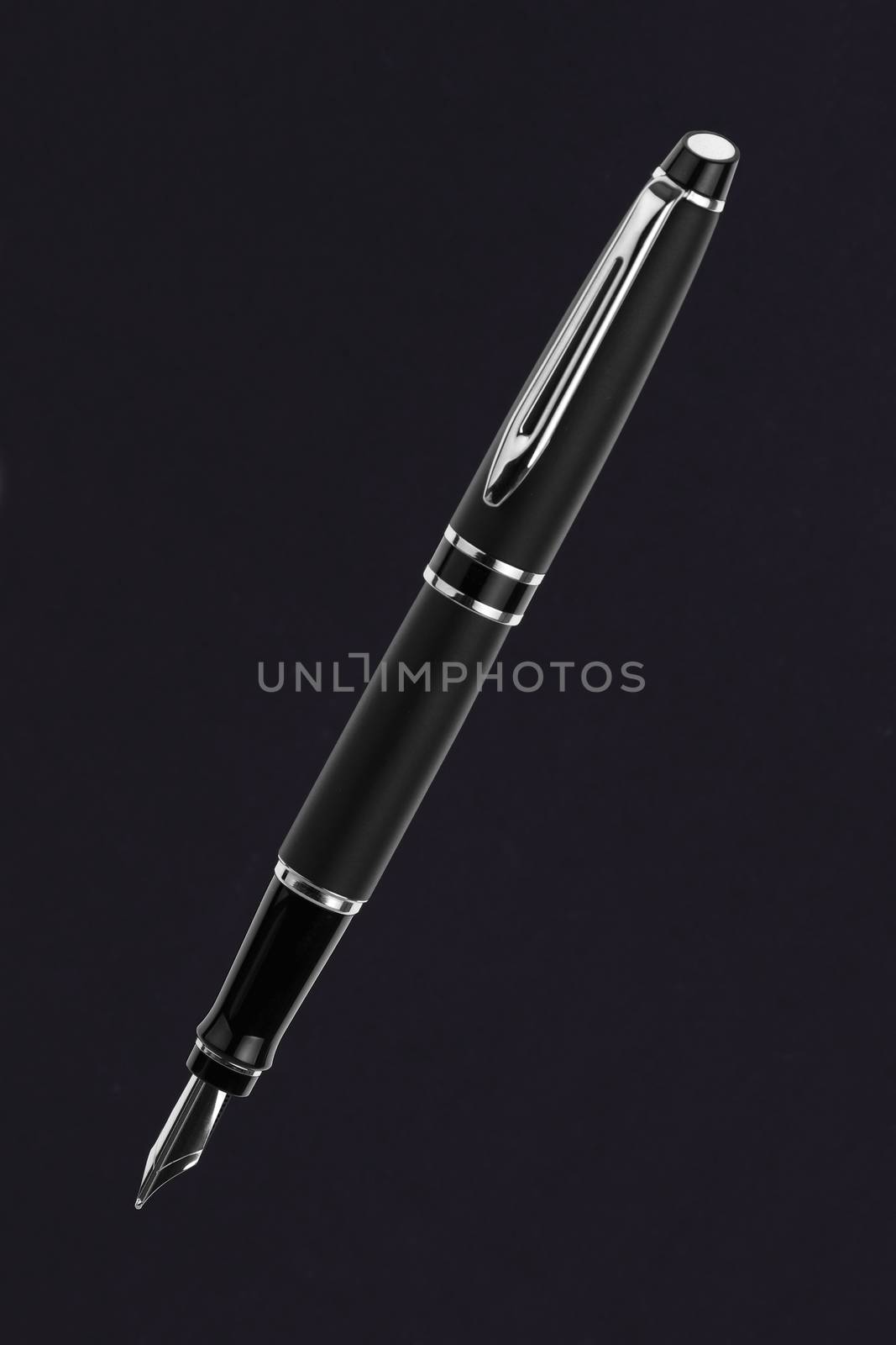 A black fountain pen on black background