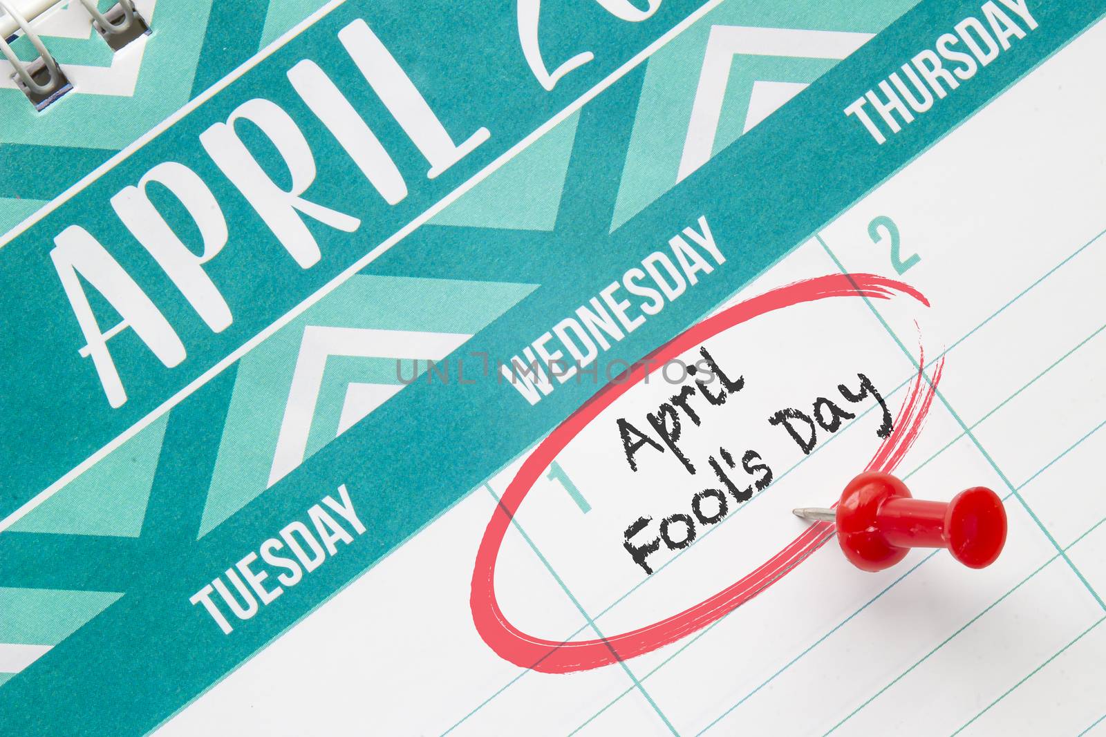 April Fool’s Day on a calendar with a red pin by oasisamuel