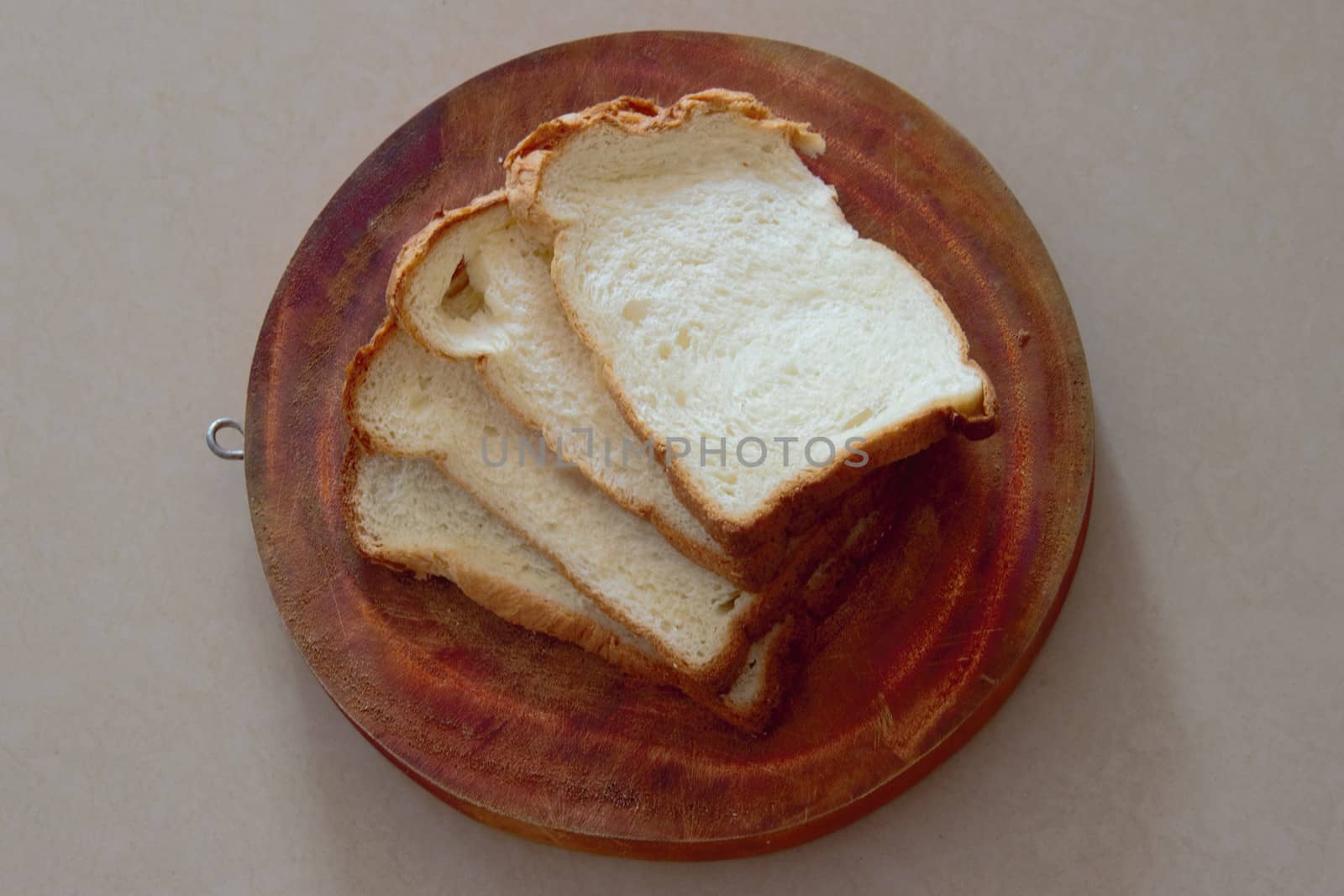 slices of white bread on a chopping board