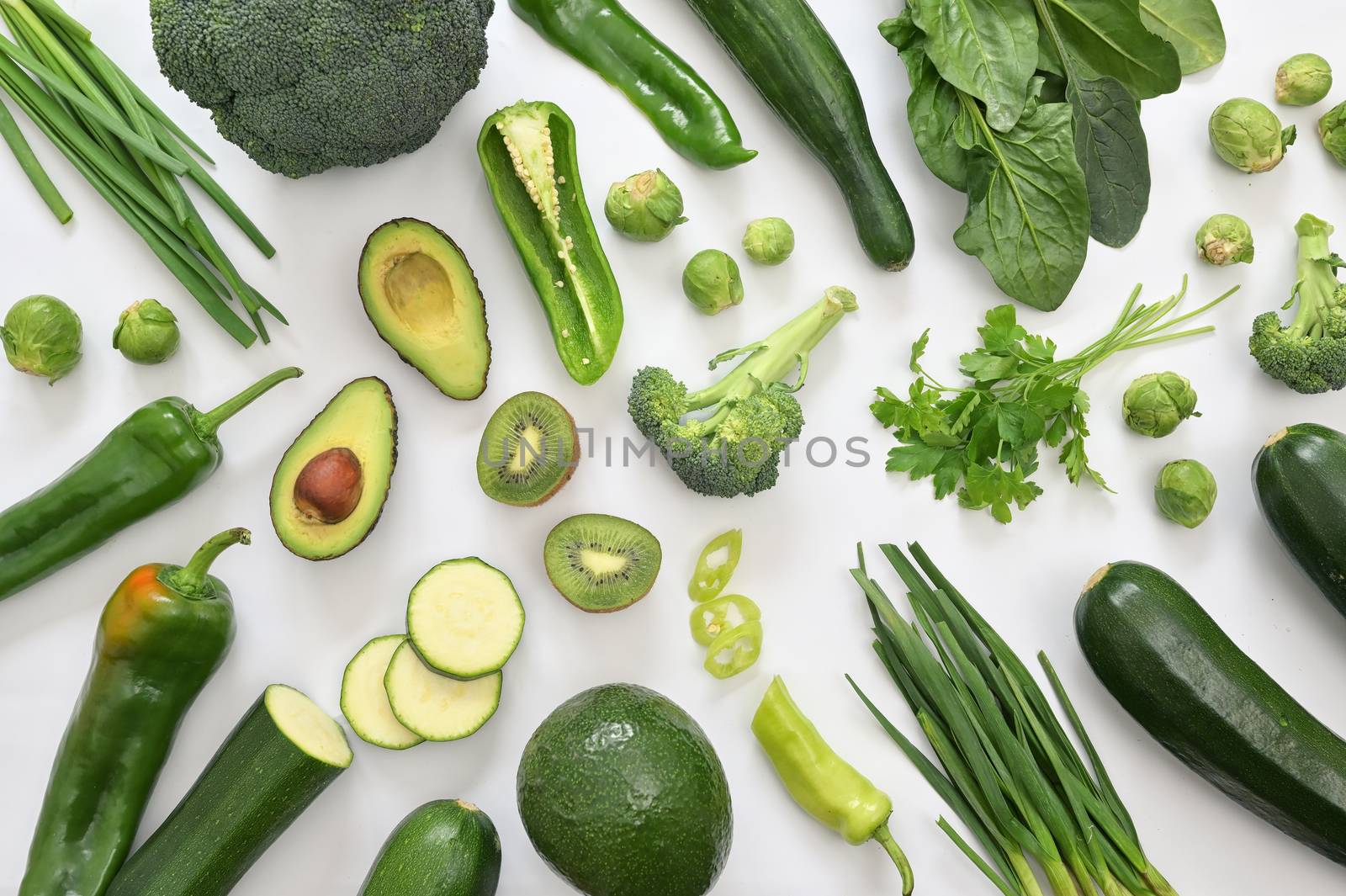 Group Of Green Vegetables And Fruits On White Background