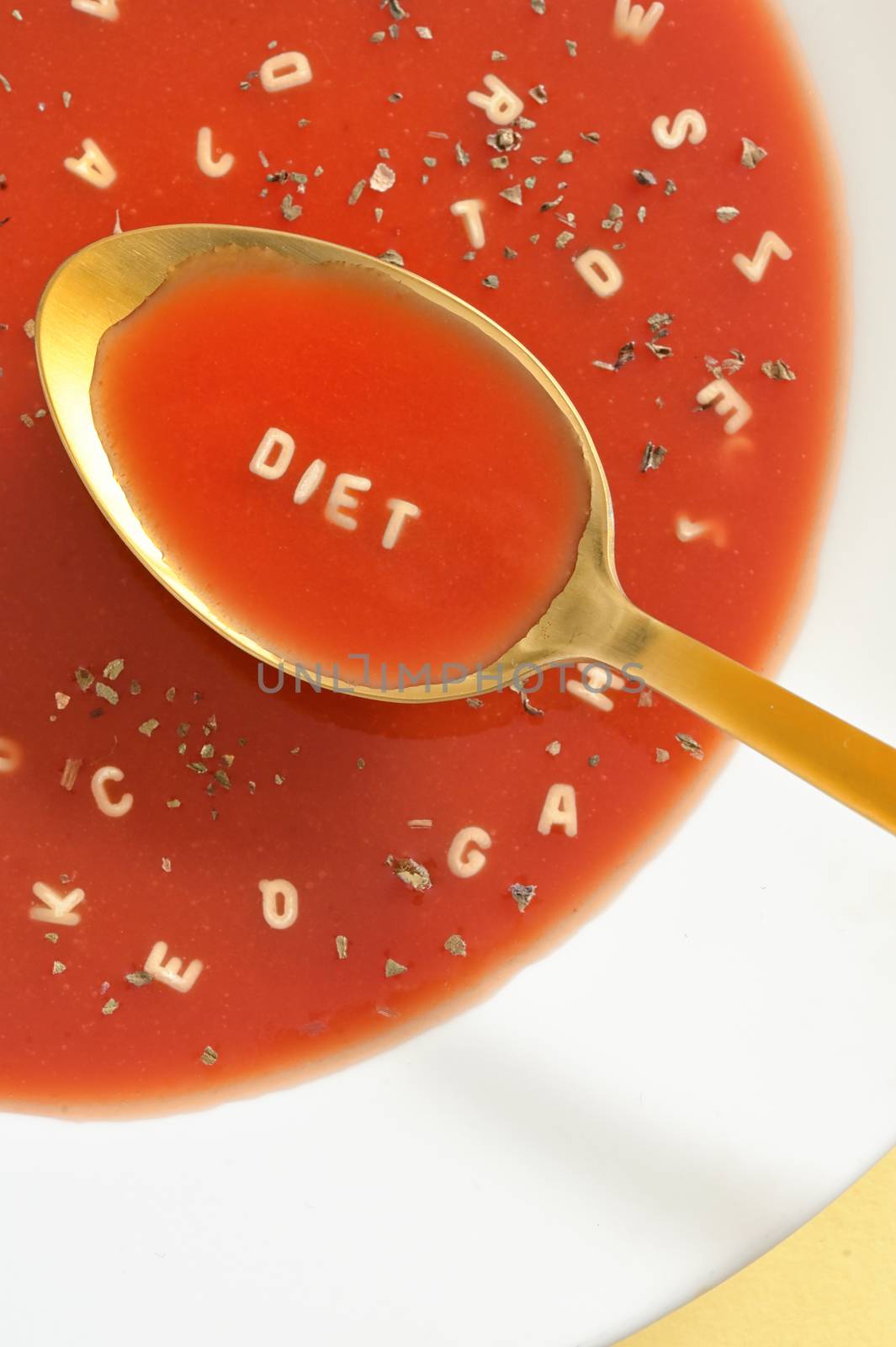 Tomato Soup With Letter Noodles On Spoon