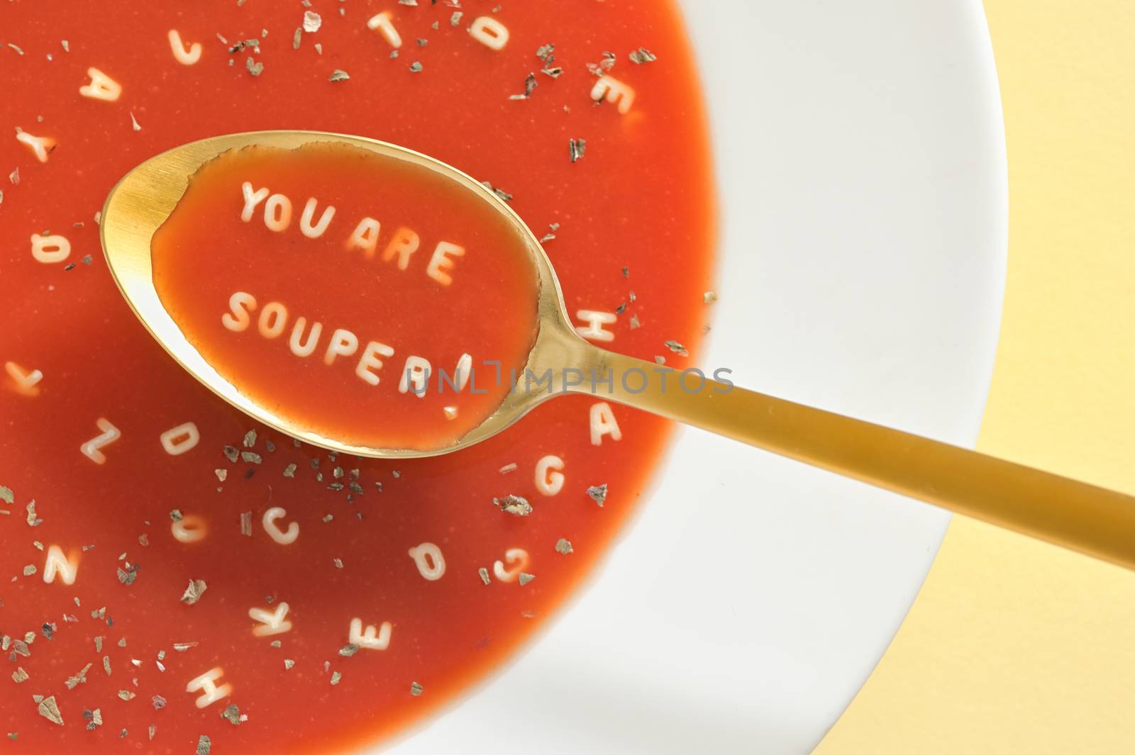 Tomato Soup With Letter Noodles On Spoon