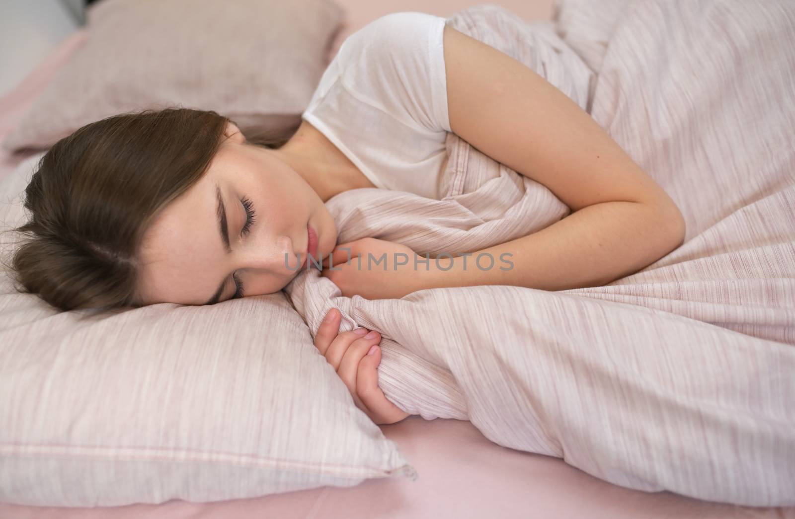 Portrait Of A Young Girl Sleeping On A Pillow