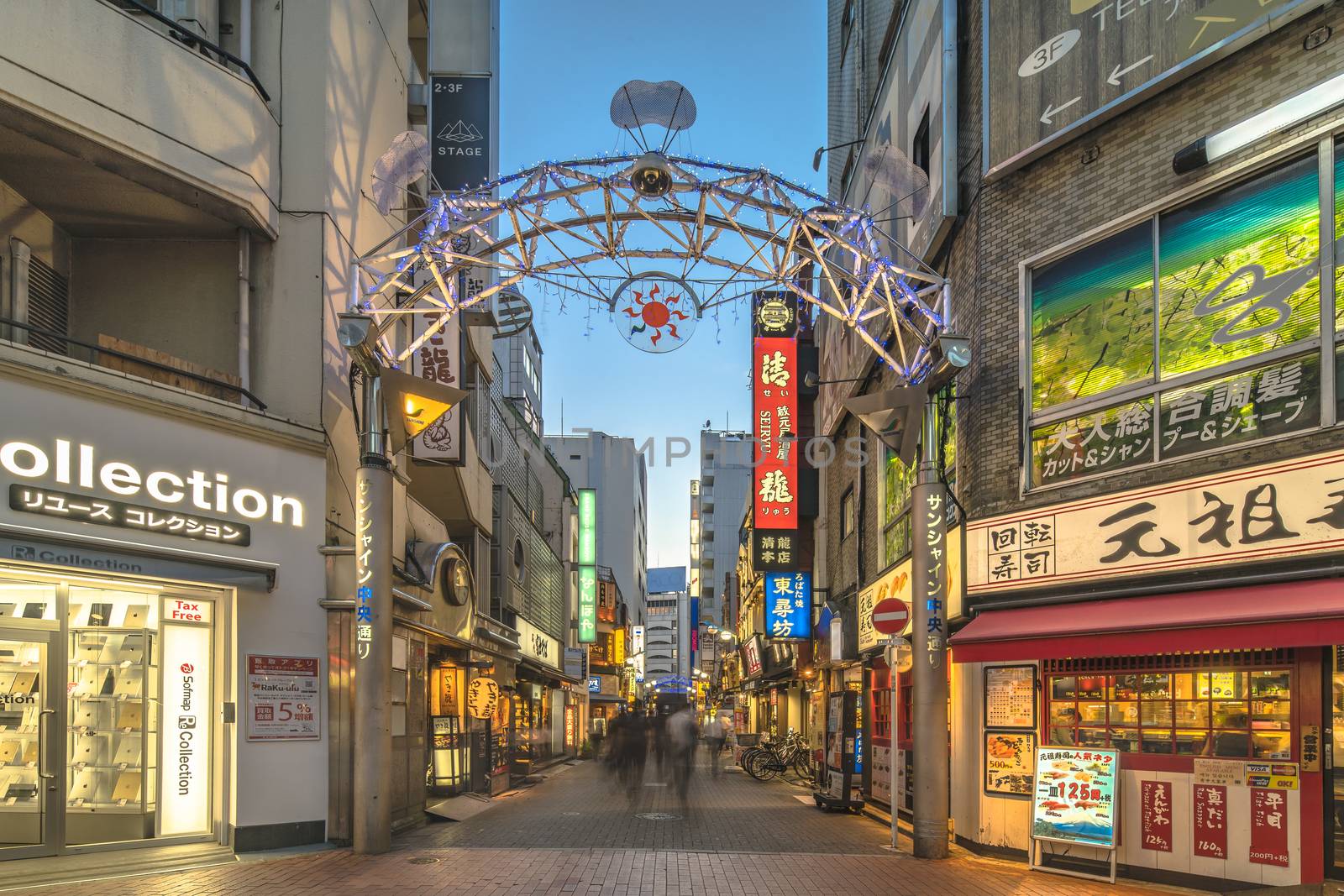 Illuminated entrance gate of the Sunshine Central Street connecting the east exit of Ikebukuro station lines with restaurants, shops, game center and cinemas leading to the famous otaku's town otome road.