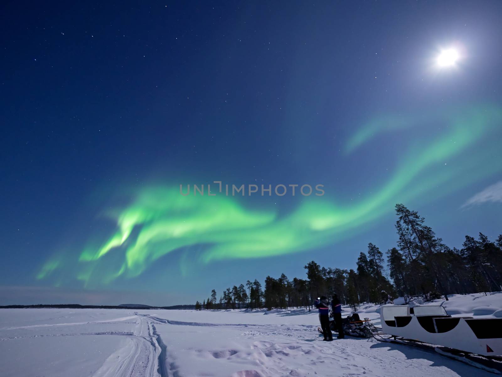 Aurora Borealis over Lake Inari in Lapland in Northern Finland.
