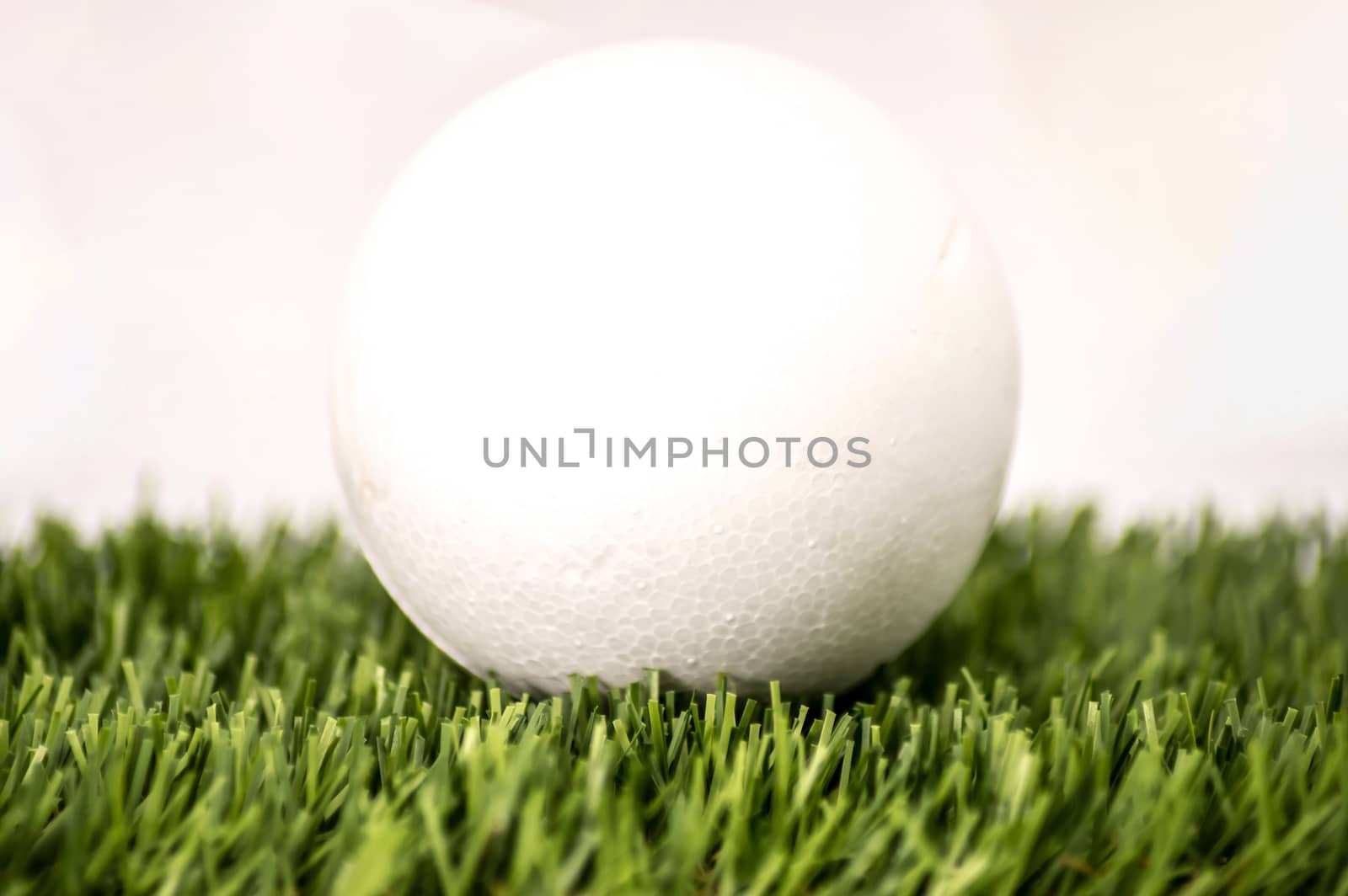 White sphere in green grass  by Philou1000