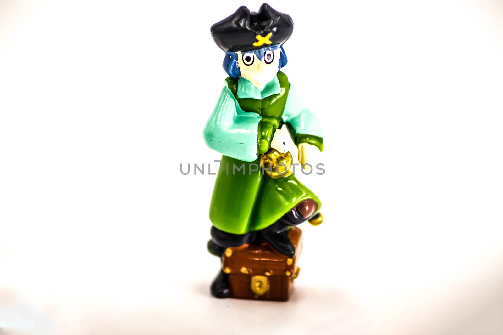 Pirate with the foot placed on a chest isolate on a white background