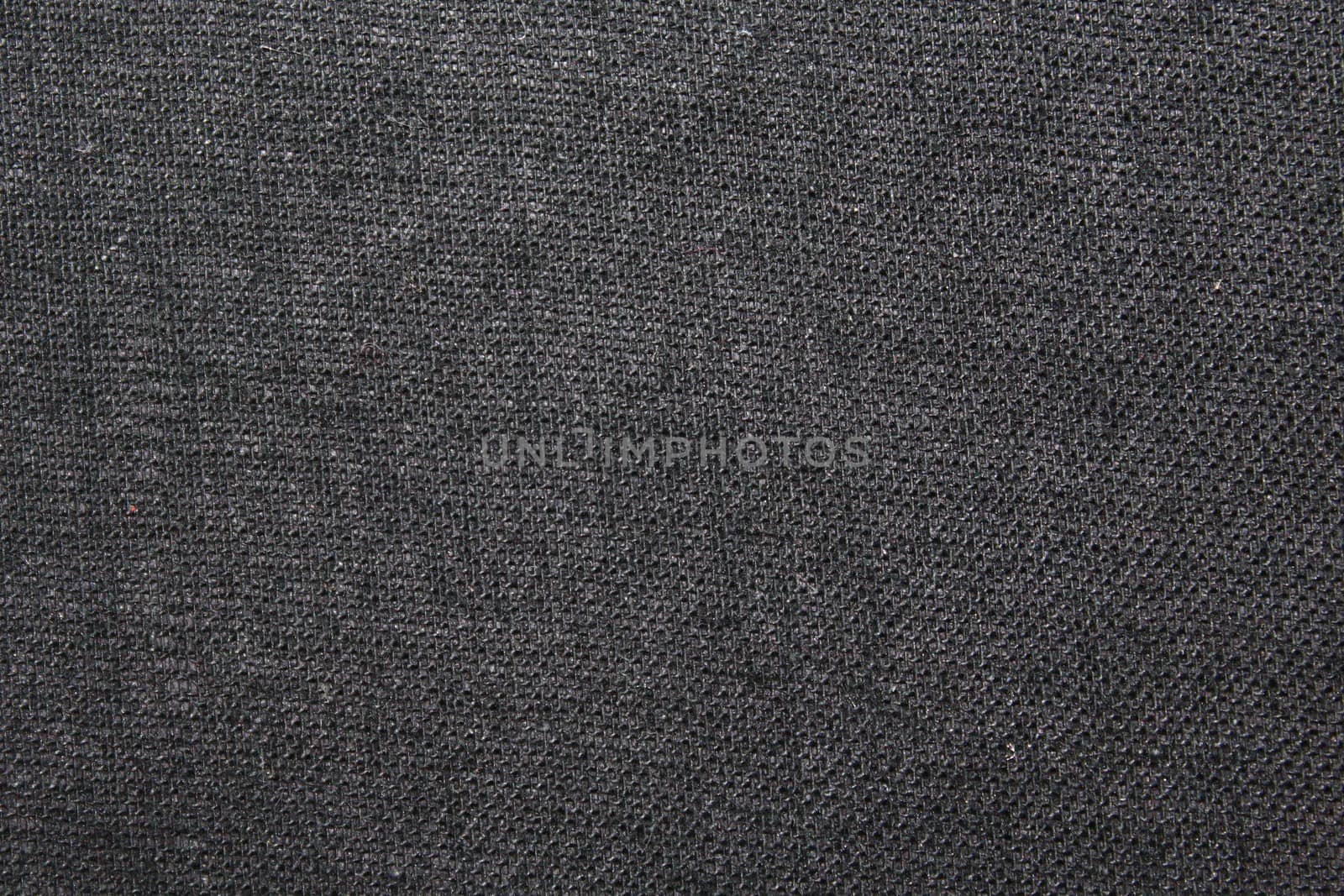 The picture shows a grey textile background with a structure